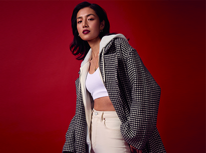 Professional photographer directing a model in-studio